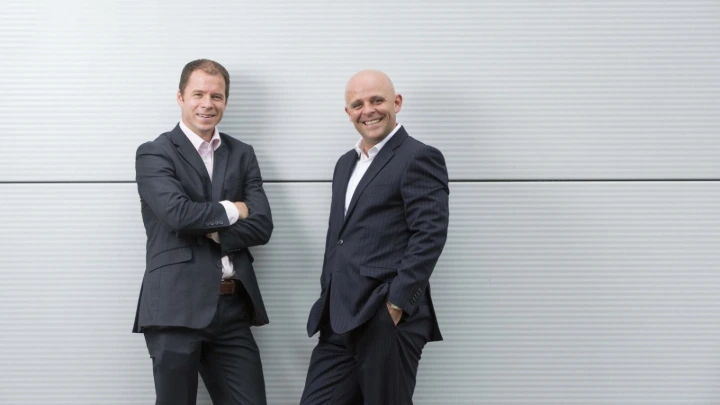 Liam Tracey and Anthony Tattan discussing GoldStar and IP Telecom cloud phone partnership
